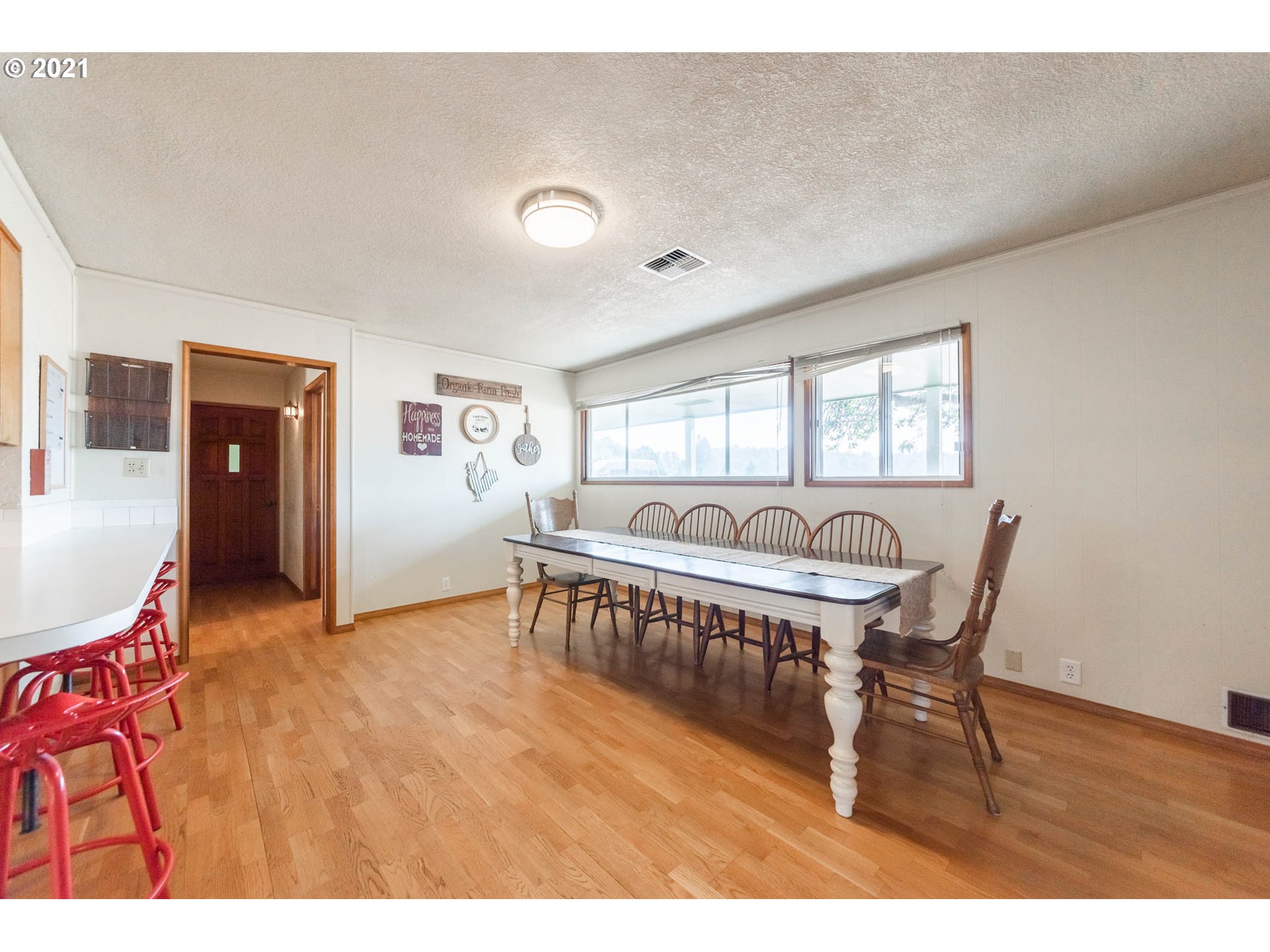 37931 M J Chase Road Springfield, OR 97478 - Photo 10 of 32 a view of a work space with furniture and wooden floor