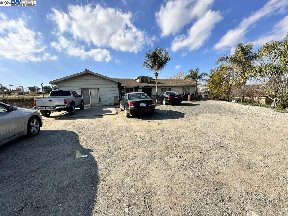 a view of a cars park in front of house