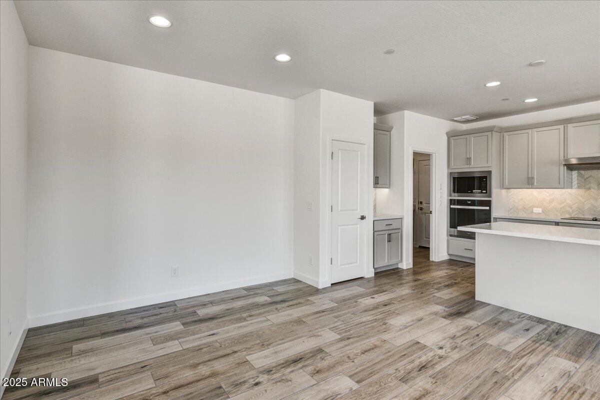 18230 East Coronado Cave Court Rio Verde, AZ 85263 - Photo 11 of 49 a view of kitchen with wooden floor and electronic appliances