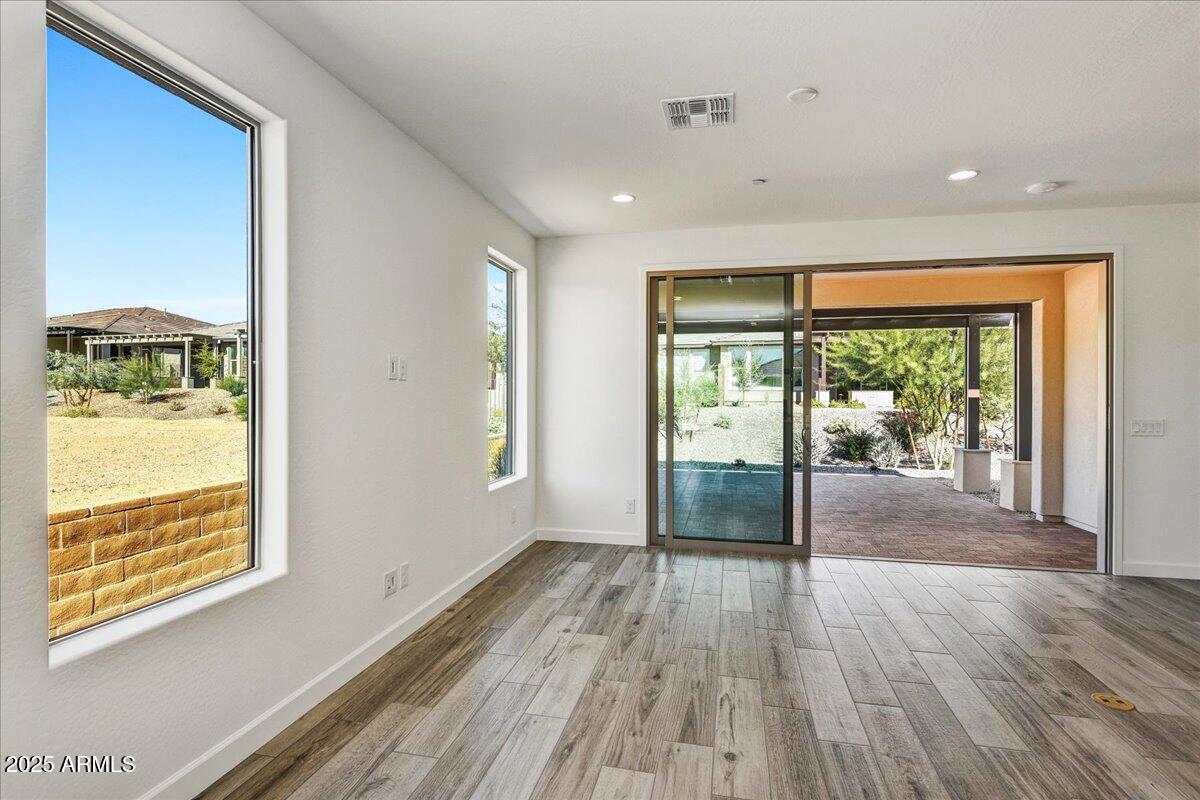 18230 East Coronado Cave Court Rio Verde, AZ 85263 - Photo 15 of 49 a view of an empty room with wooden floor and a window