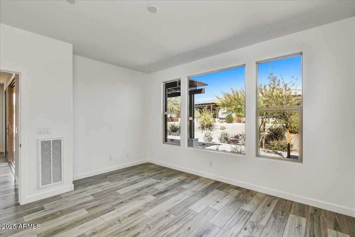 18230 East Coronado Cave Court Rio Verde, AZ 85263 - Photo 16 of 49 a view of a room with wooden floor and window