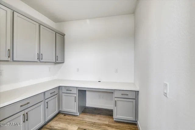 a view of cabinets and wooden floor
