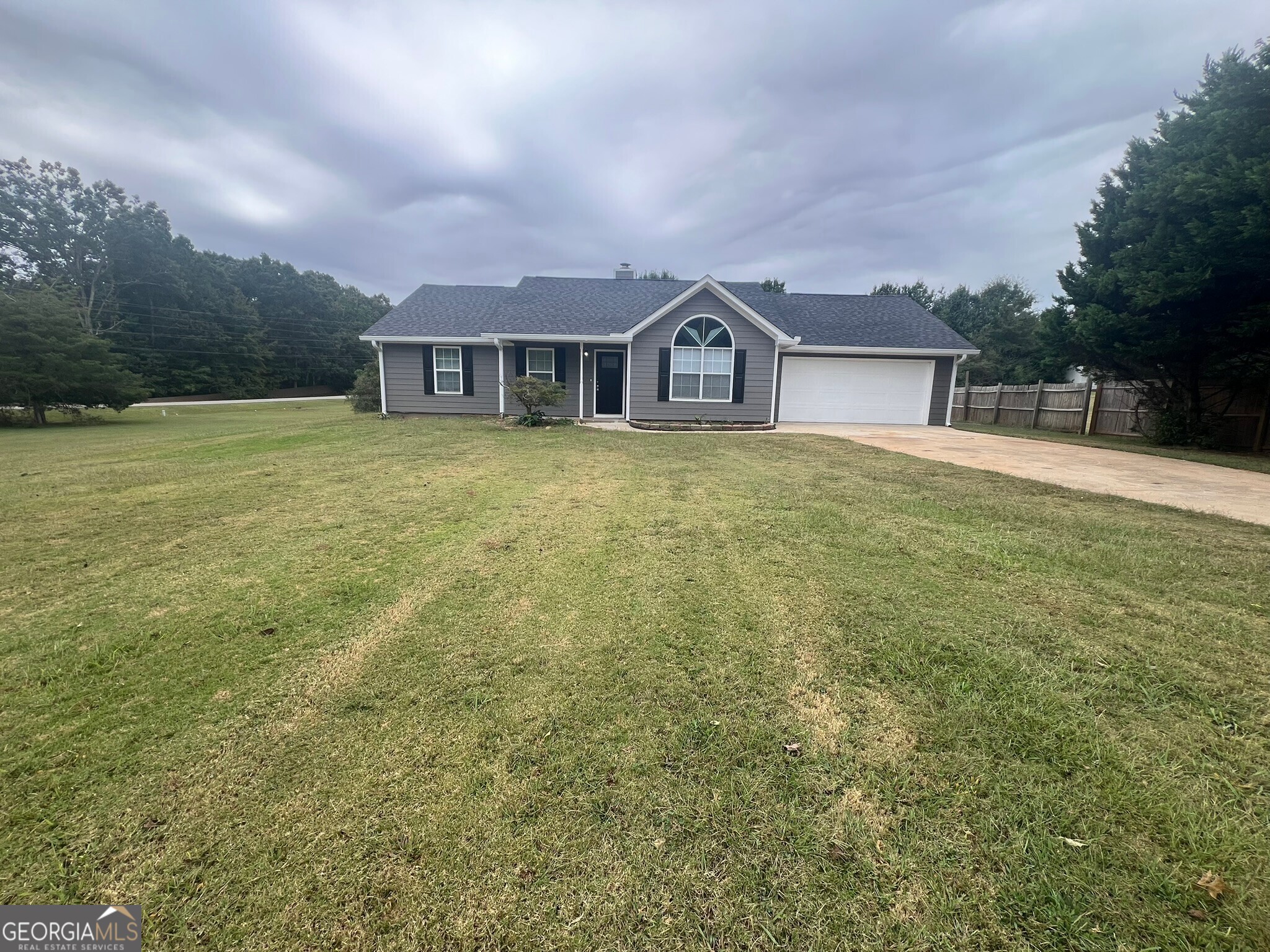 a front view of a house with yard