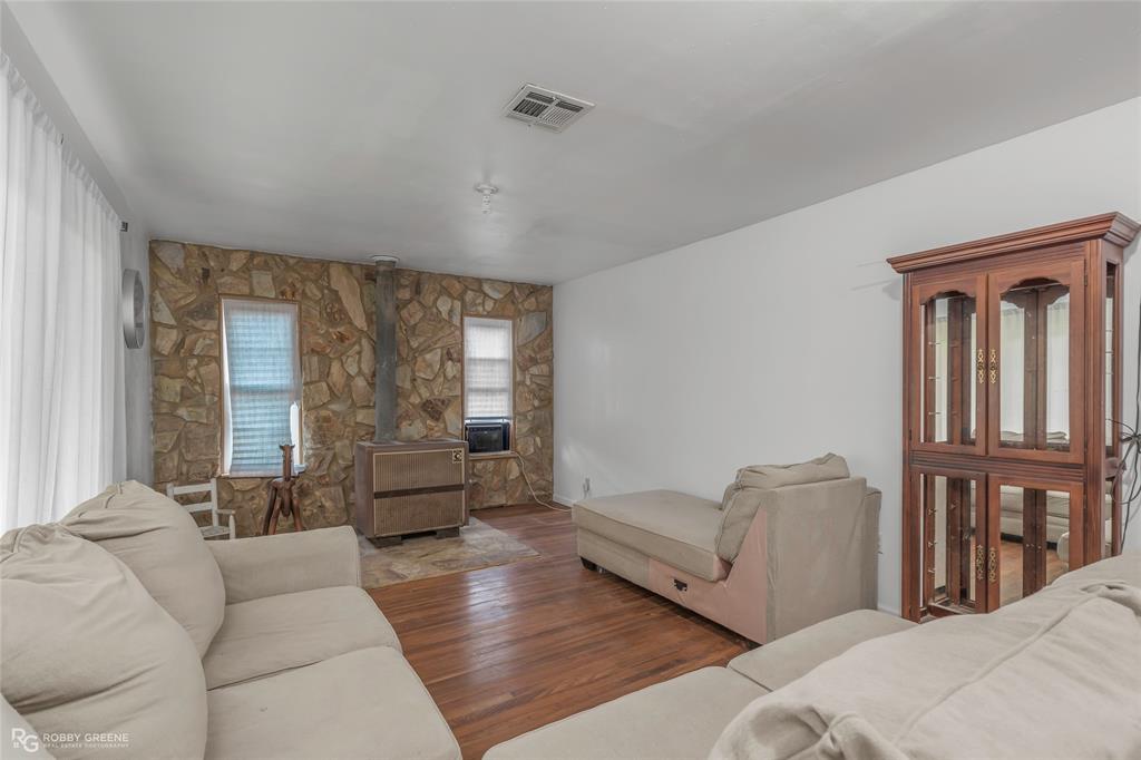 5725 Harper Road Keithville, LA 71047 - Photo 16 of 35 a living room with furniture and a large window