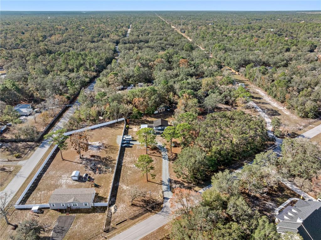 14450 Lancer Road Spring Hill, FL 34610 - Photo 11 of 46 an aerial view of residential house and outdoor space
