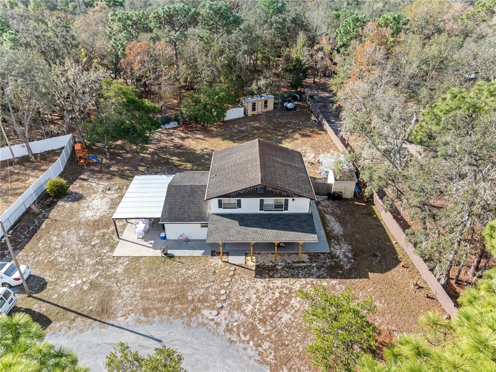 14450 Lancer Road Spring Hill, FL 34610 - Photo 13 of 46 a view of a yard with plants