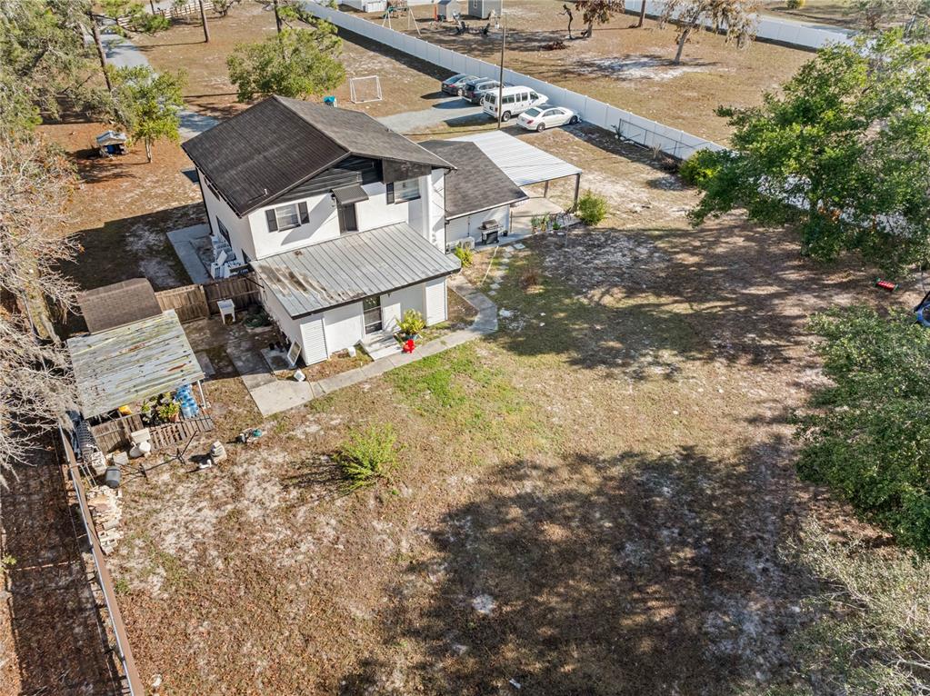 14450 Lancer Road Spring Hill, FL 34610 - Photo 16 of 46 an aerial view of residential houses with outdoor space