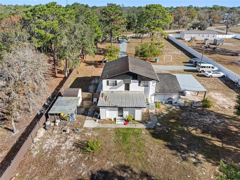14450 Lancer Road Spring Hill, FL 34610 - Photo 17 of 46 an aerial view of a house with a yard