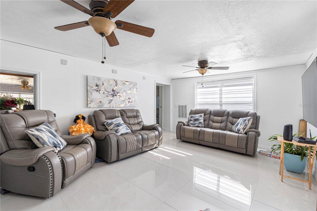 14450 Lancer Road Spring Hill, FL 34610 - Photo 38 of 46 a living room with furniture and a window
