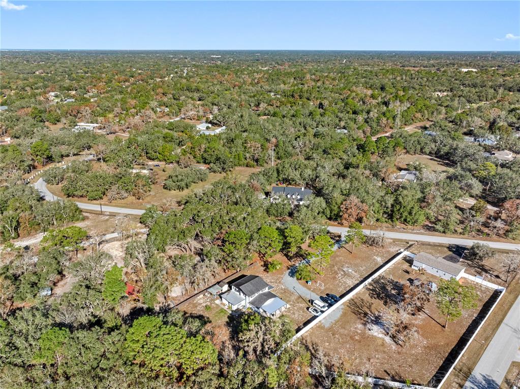14450 Lancer Road Spring Hill, FL 34610 - Photo 46 of 46 an aerial view of residential houses with outdoor space