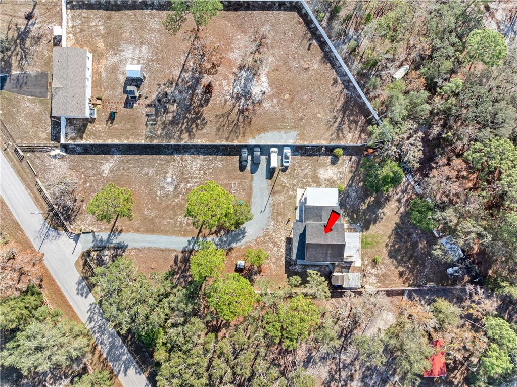14450 Lancer Road Spring Hill, FL 34610 - Photo 9 of 46 an aerial view of a house with swimming pool and garden