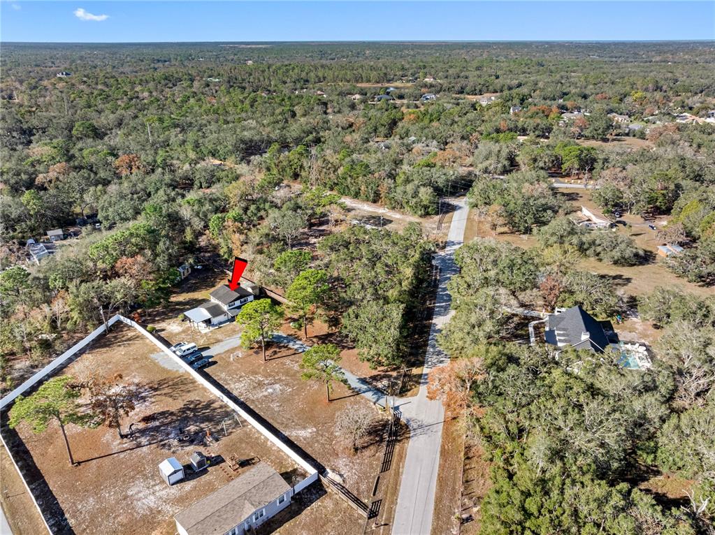 14450 Lancer Road Spring Hill, FL 34610 - Photo 10 of 46 an aerial view of a house with a mountain