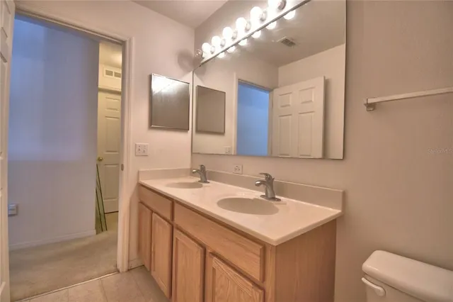 a view of a hallway with couch and chandelier