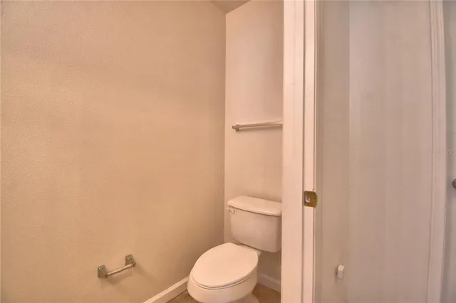 a kitchen with stainless steel appliances kitchen island granite countertop a refrigerator a sink and a stove