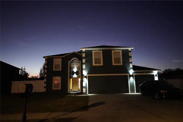 a kitchen with a sink a stove and cabinets