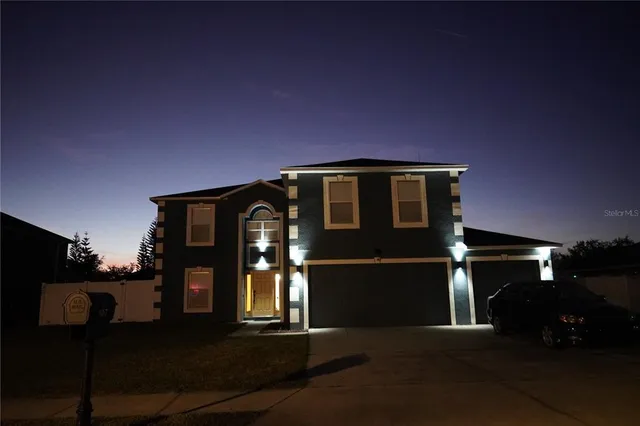a kitchen with stainless steel appliances a sink stove and refrigerator