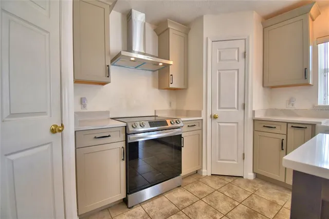 a dining room with furniture and a window