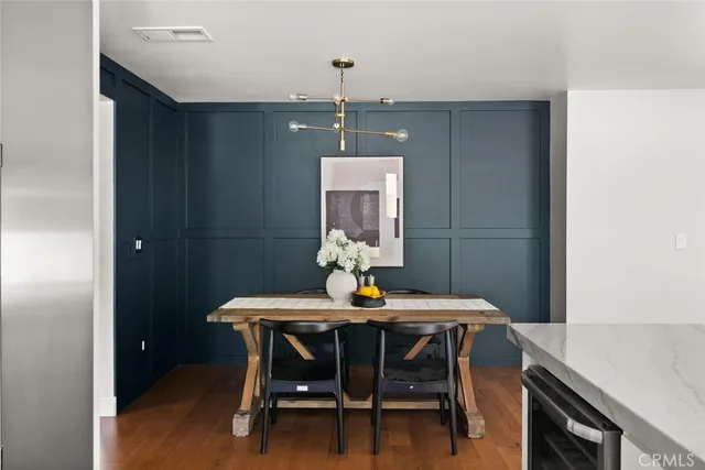 a dining room with a table and chairs