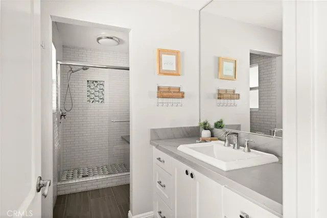 a bedroom with furniture and a large window