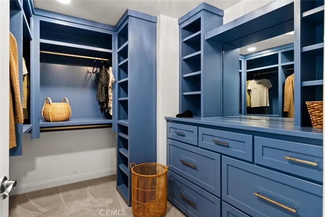 a bathroom with double sink and a mirror