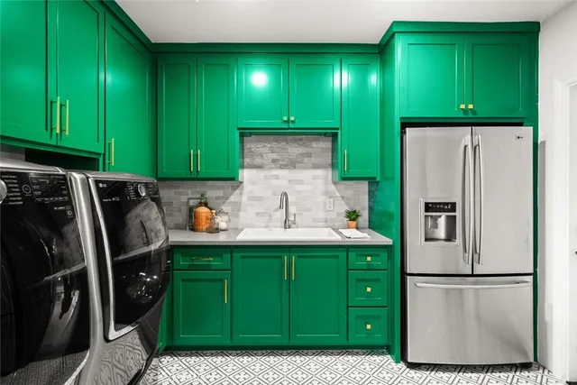 a kitchen with stainless steel appliances granite countertop a stove microwave and sink