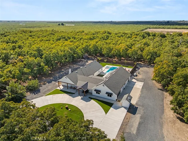 an aerial view of a house with a ocean view