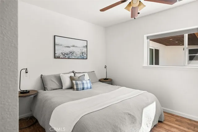 a bedroom that has a bed and a chair in it