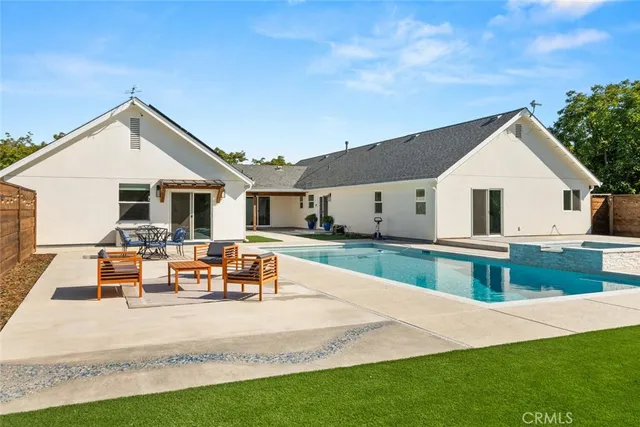a view of a swimming pool with a yard