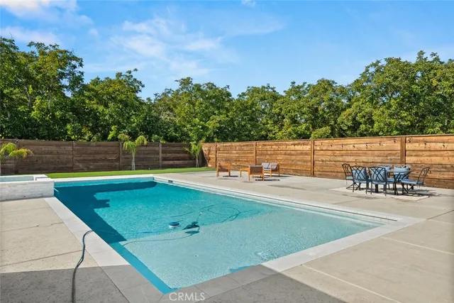 a view of an house with backyard and porch