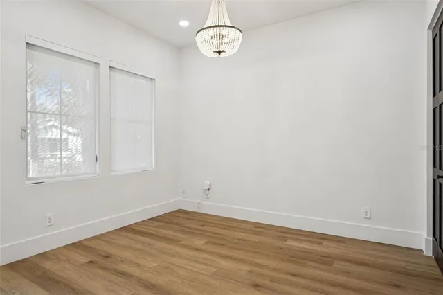 a kitchen with kitchen island a sink and a stove top oven