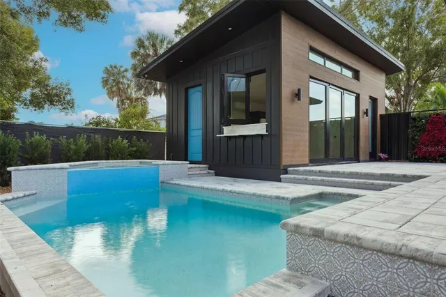 a view of a room with wooden floor and windows