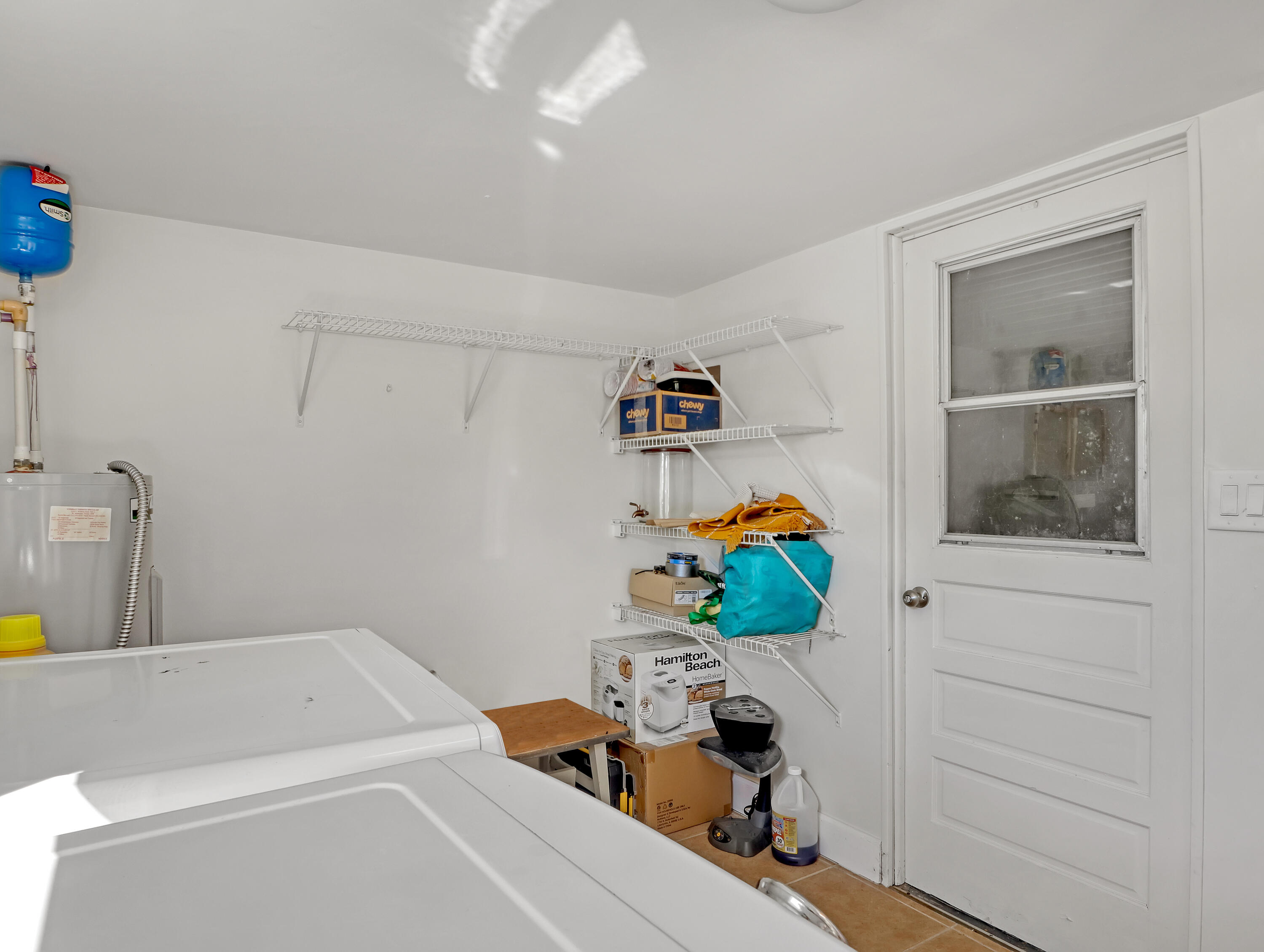 2711 Locksley Road Melbourne, FL 32935 - Photo 15 of 34 a bathroom with a sink mirror and vanity