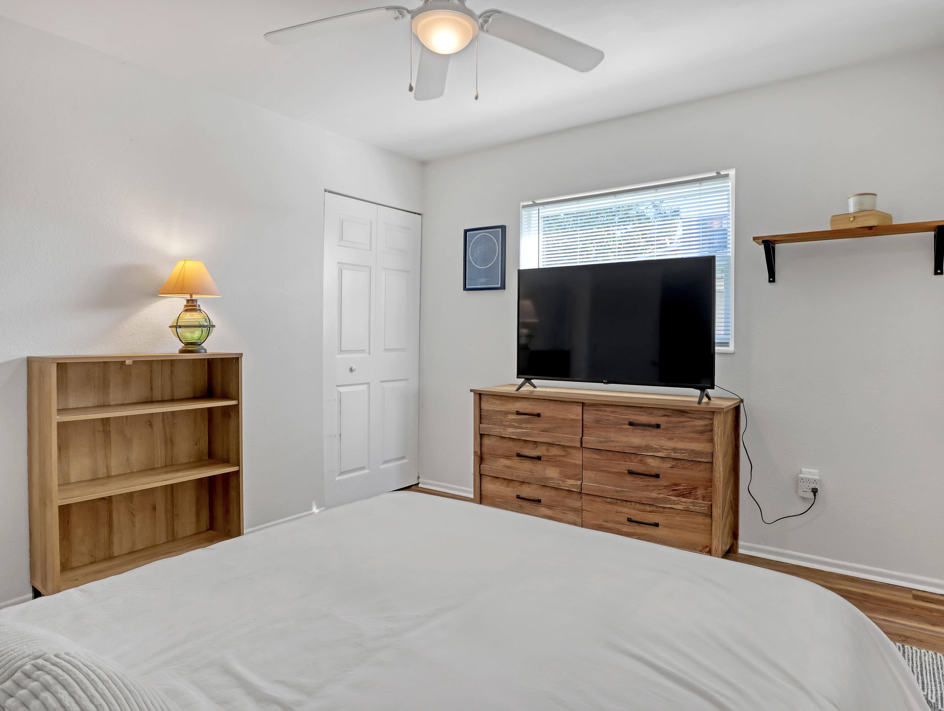 2711 Locksley Road Melbourne, FL 32935 - Photo 18 of 34 a bedroom with a bed and flat screen tv