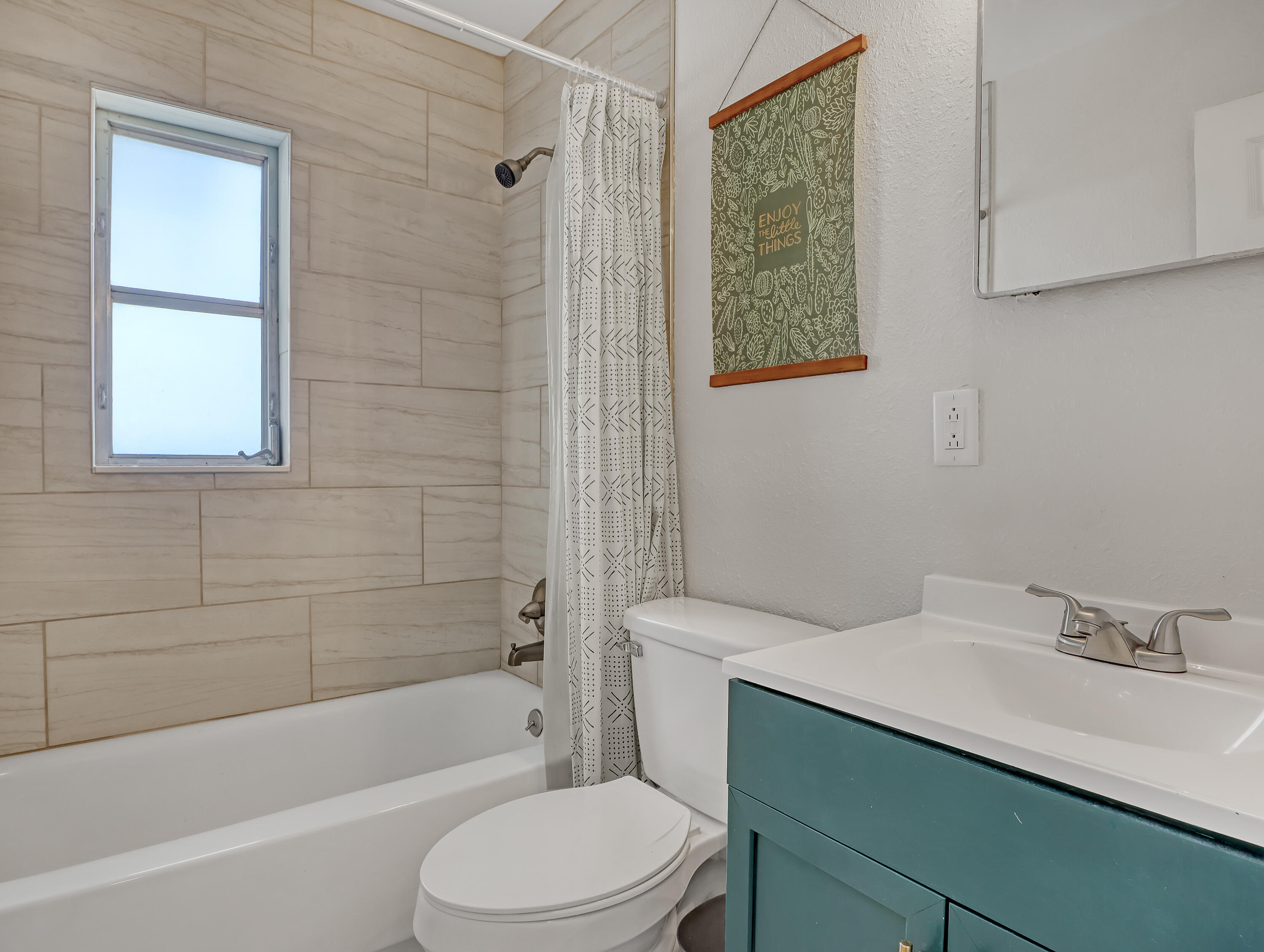 2711 Locksley Road Melbourne, FL 32935 - Photo 26 of 34 a bathroom with a sink toilet and shower