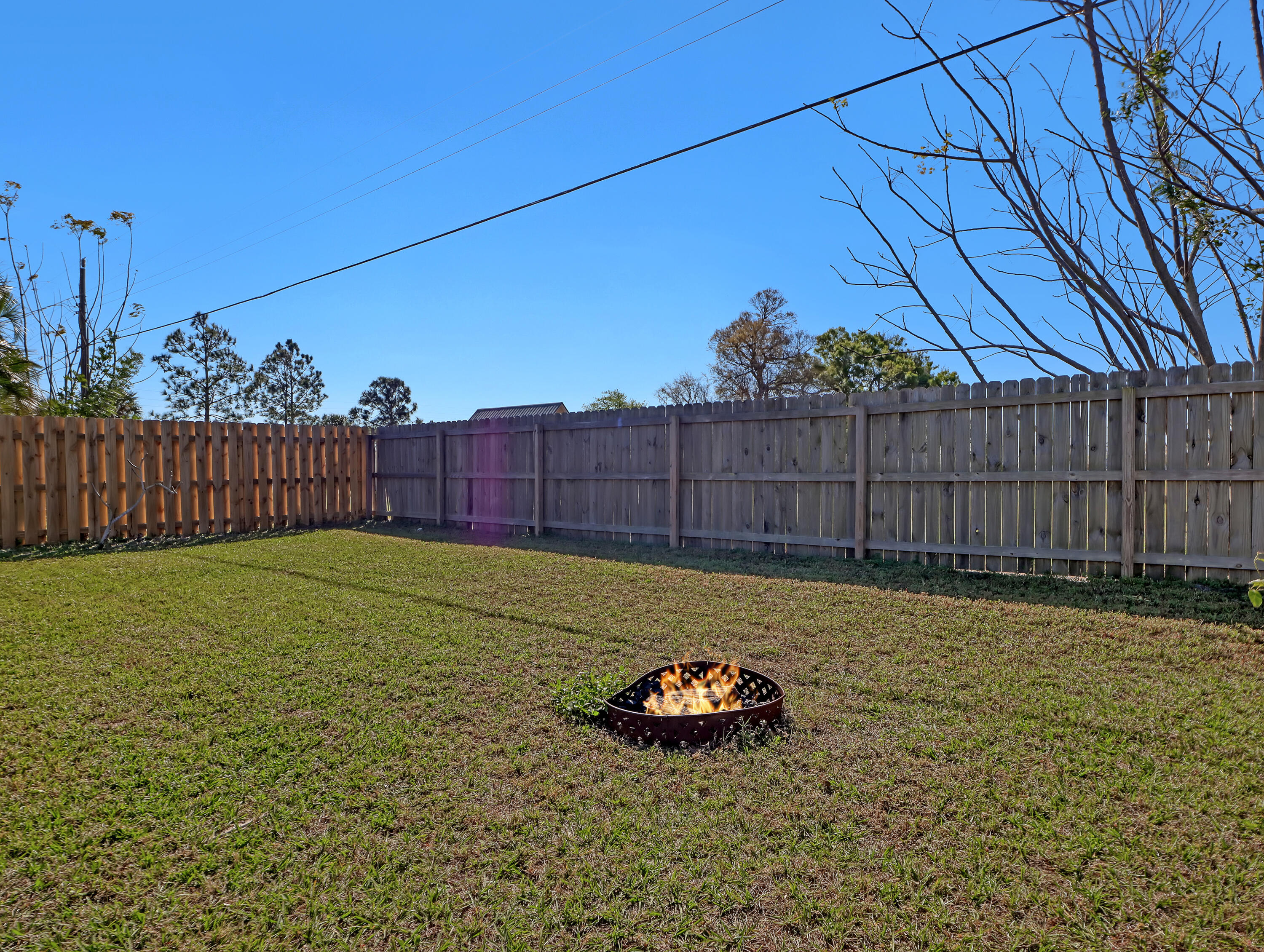 2711 Locksley Road Melbourne, FL 32935 - Photo 34 of 34 a view of a backyard with wooden fence