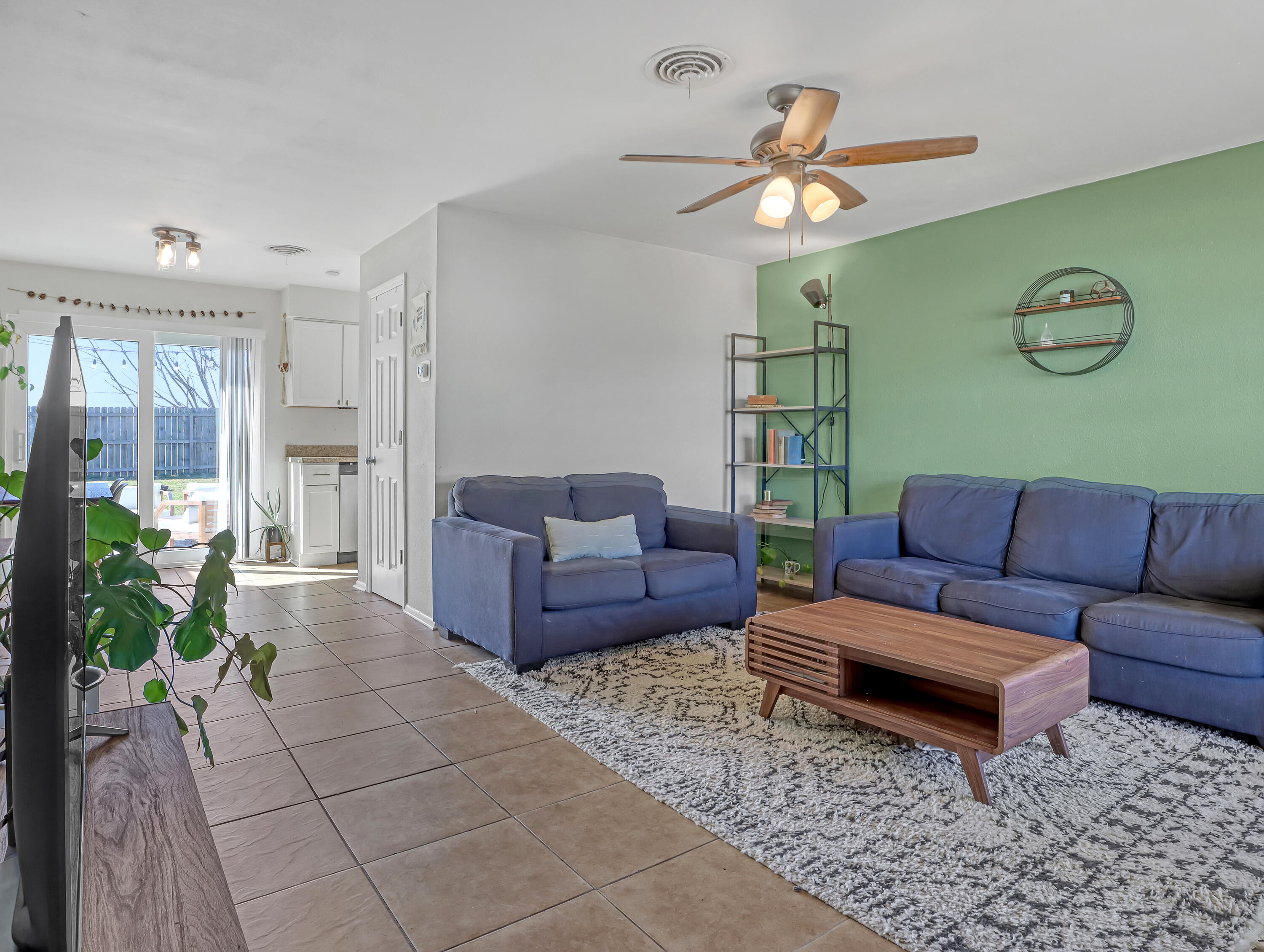 2711 Locksley Road Melbourne, FL 32935 - Photo 6 of 34 a living room with furniture and a large window