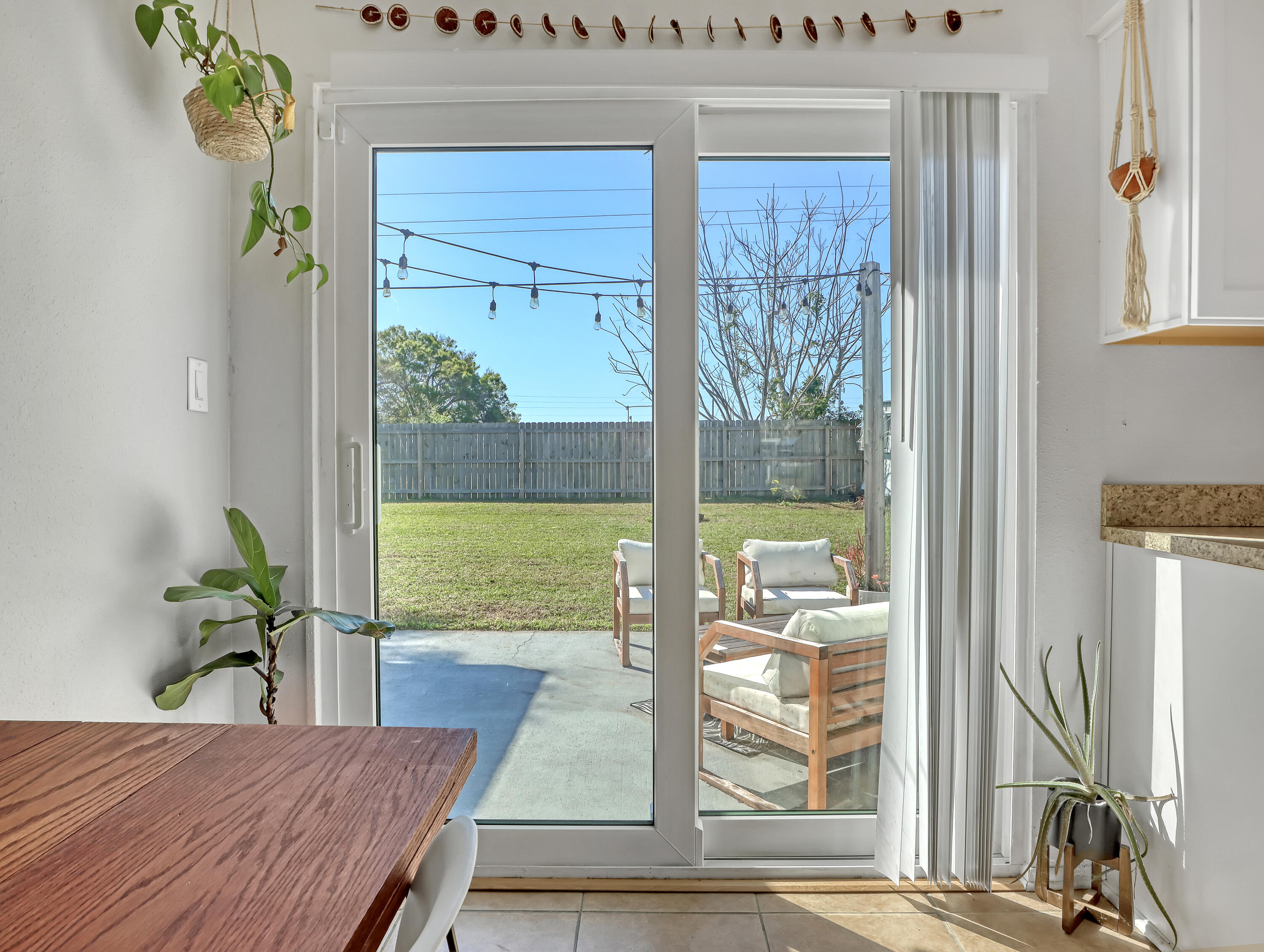 2711 Locksley Road Melbourne, FL 32935 - Photo 10 of 34 a view of a dining room with furniture window and wooden floor