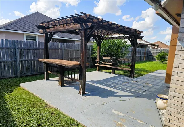 a view of a backyard with sitting area