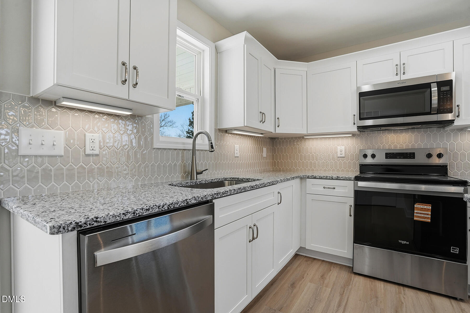 232 Rae Street Warsaw, NC 28398 - Photo 14 of 31 a kitchen with stainless steel appliances granite countertop a sink dishwasher a stove and a microwave oven on granite countertops
