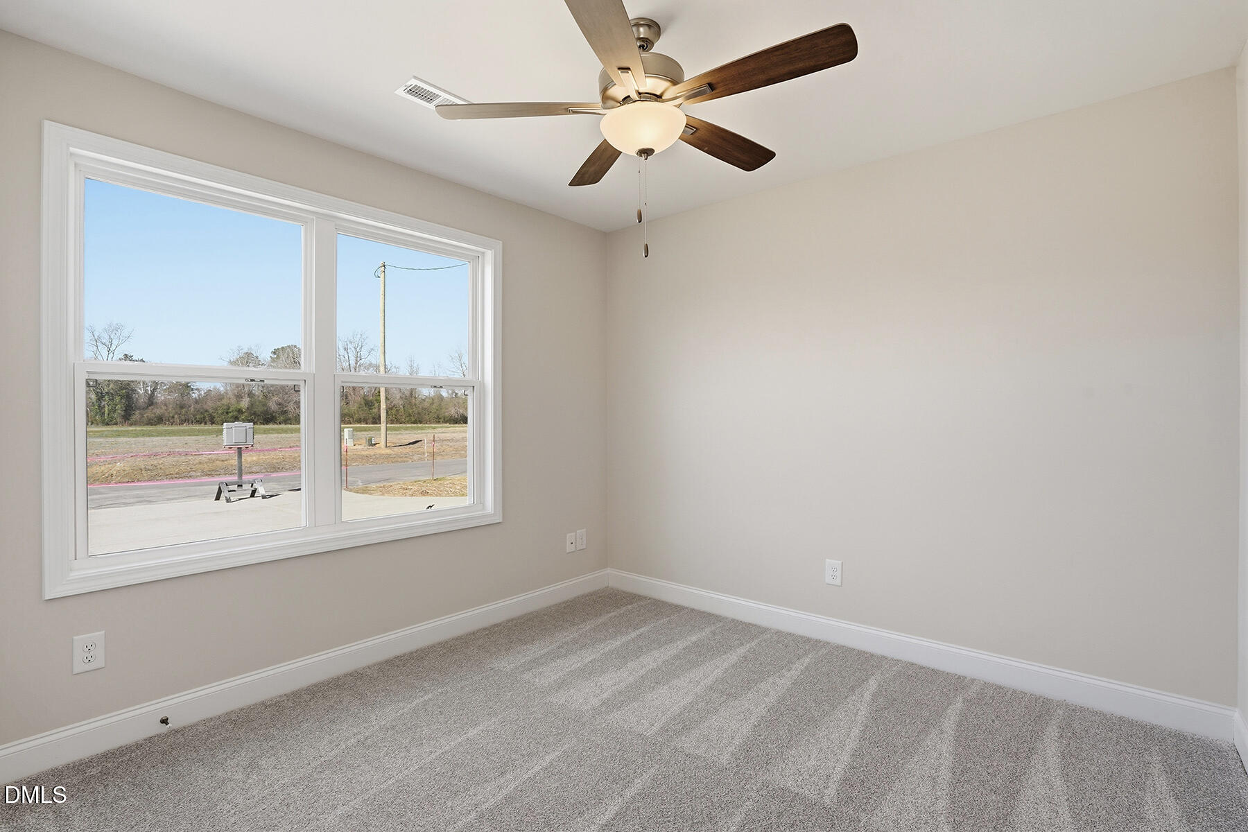 232 Rae Street Warsaw, NC 28398 - Photo 15 of 31 an empty room with a window and a fan