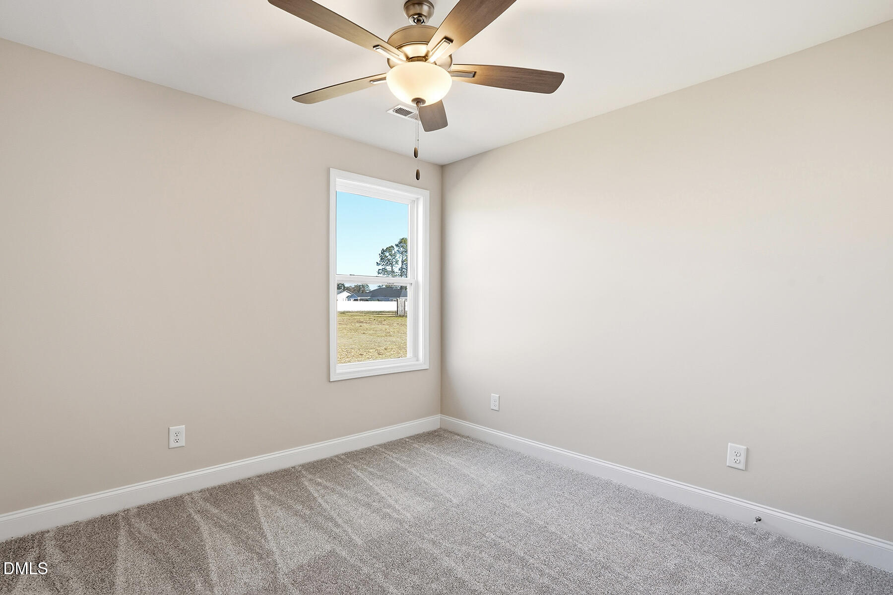 232 Rae Street Warsaw, NC 28398 - Photo 18 of 31 an empty room with a window and a fan