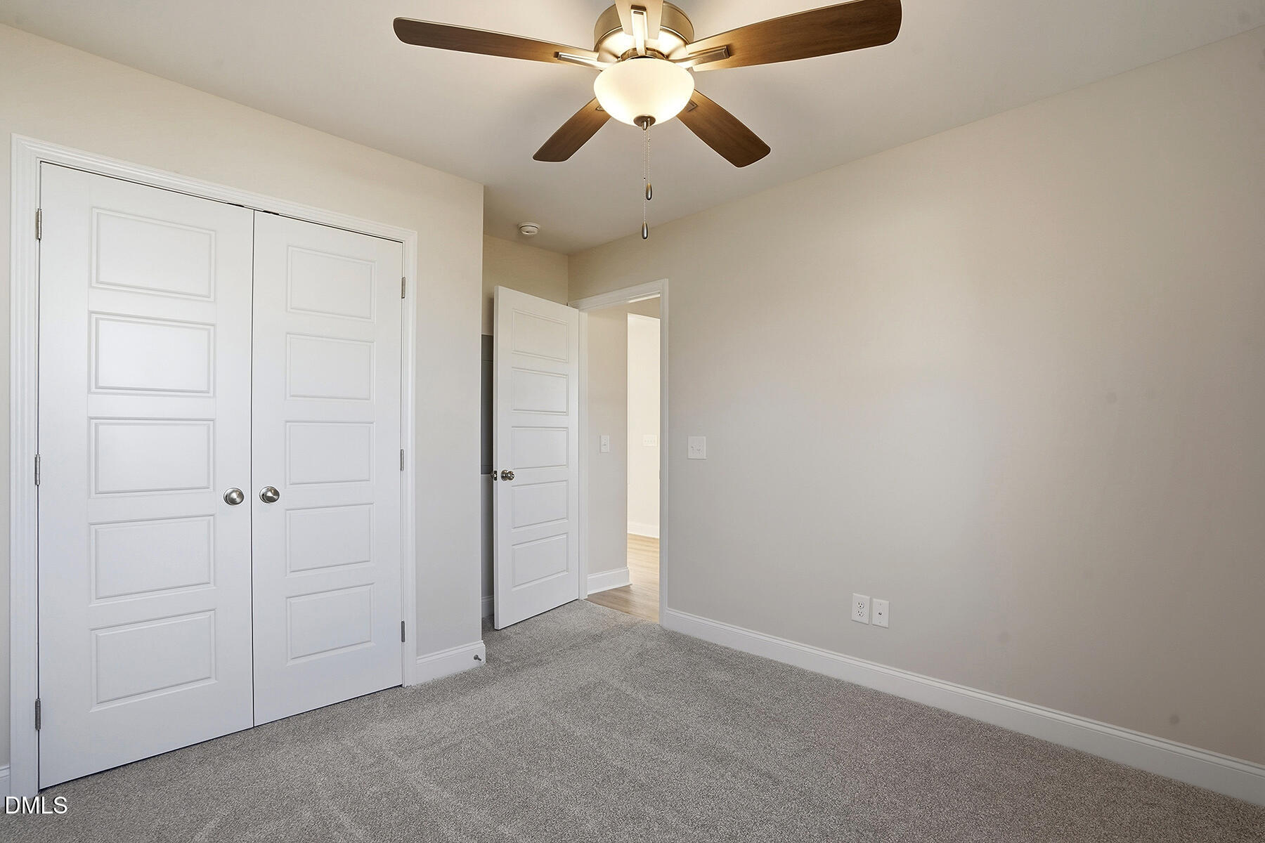 232 Rae Street Warsaw, NC 28398 - Photo 19 of 31 an empty room with closet and a chandelier fan