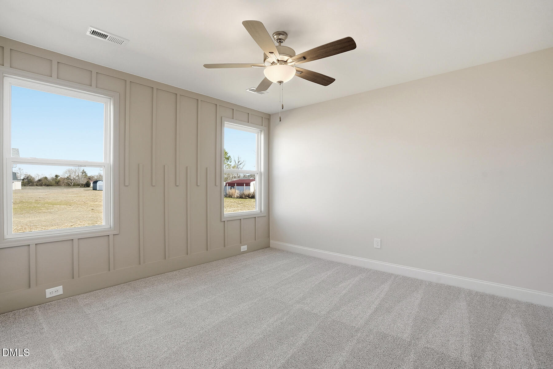 232 Rae Street Warsaw, NC 28398 - Photo 21 of 31 an empty room with windows and fan