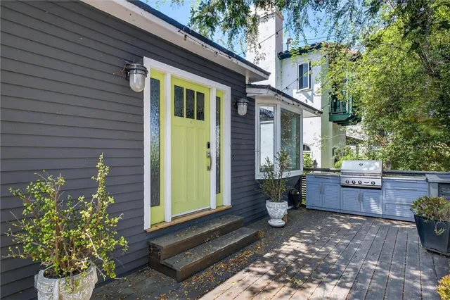 a backyard of a house with outdoor seating