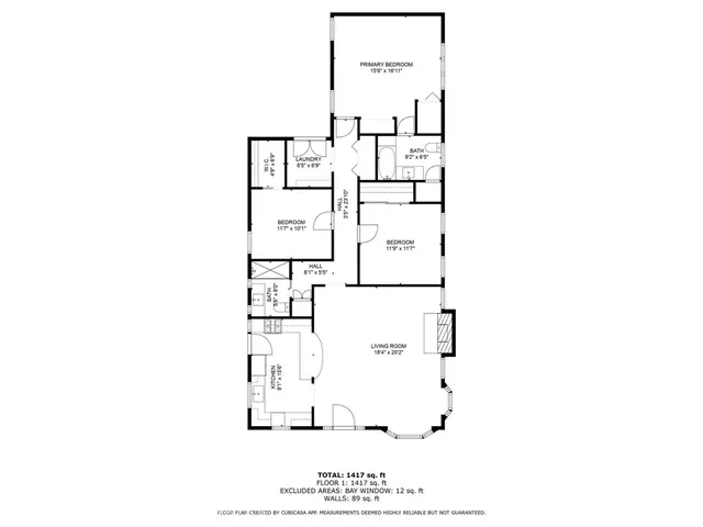 a picture of a bench in front of a building