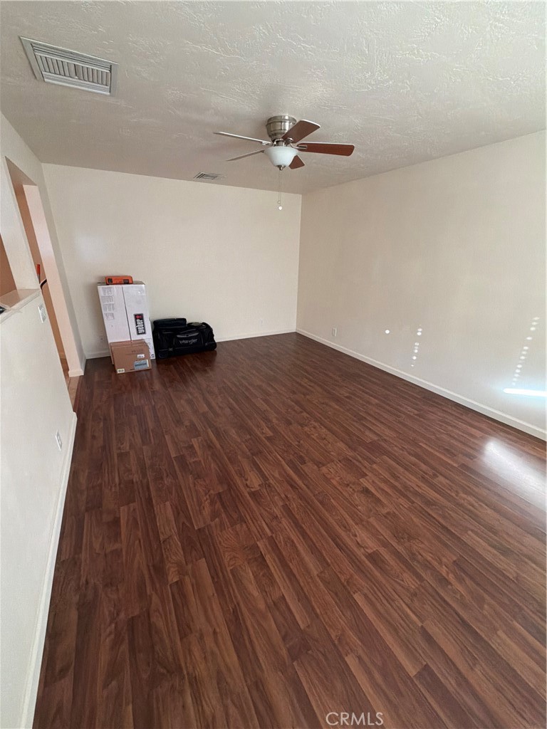 209 Kimberly Lane Ridgecrest, CA 93555 - Photo 40 of 62 a view of empty room with wooden floor