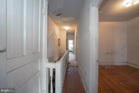 a view of a livingroom with stairs