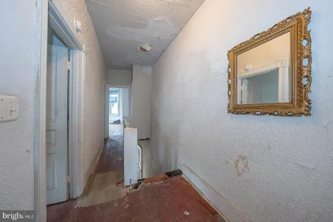 a view of a hallway that has front door