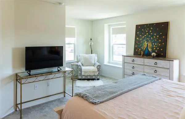 a living room with furniture and flat screen tv