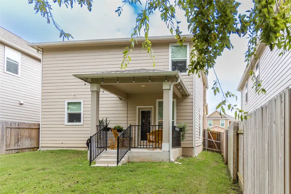 a balcony with wooden floor outdoor seating and furniture